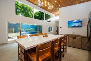 Kitchen area in your Guanacaste vacation rental - island with chairs ready for your group to have a lovely dinner