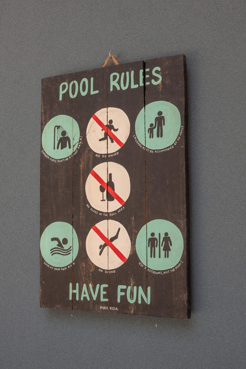 Pool rules sign, have fun! Icons showing what you can and cannot do for the pool rules at Casa Carlayna