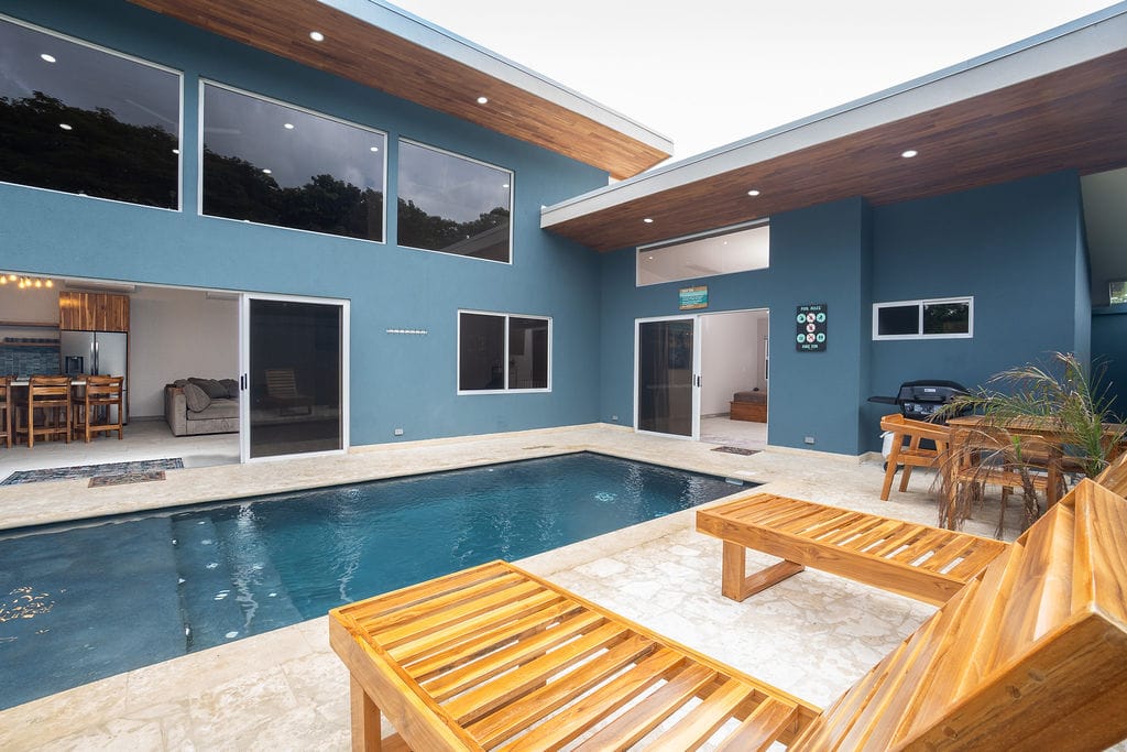 Casa Fenix with pool chairs overlooking the pool and house