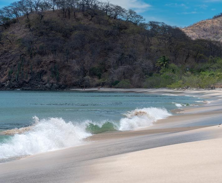 Waves crashing on the shores of Playa Penca, Guanacaste, Costa Rica. Beaches of Potrero splotlight Playa Penca.