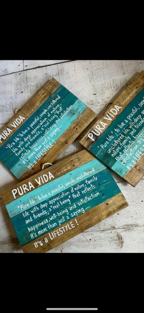 Handcrafted wooden signs about the Pura Vida Costa Rican lifestile