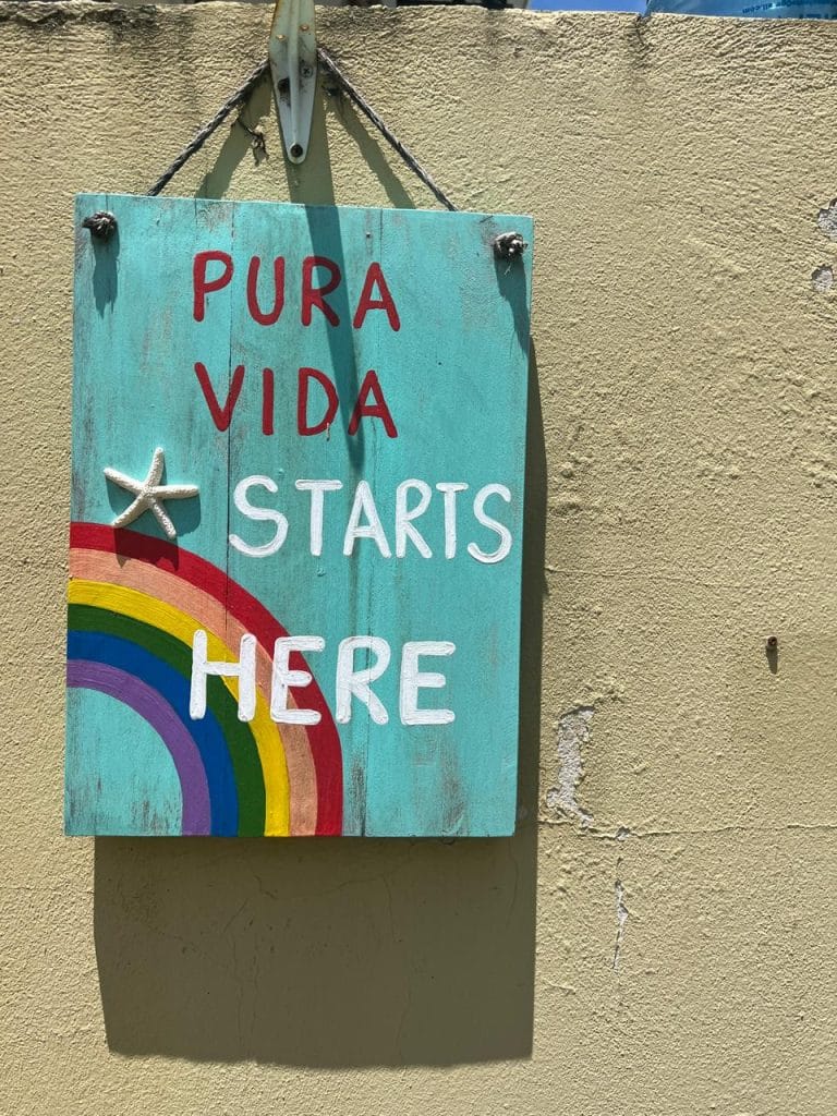 Pura Vida Starts Here Sign - Commitment to Local Partnerships in Playa Potrero